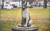  ??  ?? The statue of Zorik shows him warming up a kitten. Zorik once had a dog companion who was killed in a car accident. He then took up with stray cats and was seen with them often, even while sleeping.