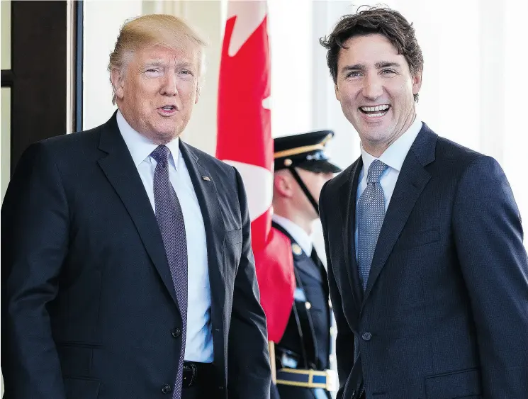  ?? ANDREW HARNIK / THE CANADIAN PRESS FILES ?? President Donald Trump welcomes Prime Minister Justin Trudeau outside the West Wing of the White House last February.