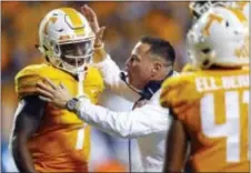  ?? WADE PAYNE — THE ASSOCIATED PRESS FILE ?? Tennessee head coach Butch Jones encourages wide receiver Marquez Callaway (1) in the second half of a game against Southern Mississipp­i in Knoxville. Vols athletic director John Currie said Sunday that Tennessee has fired Jones with two games left in...