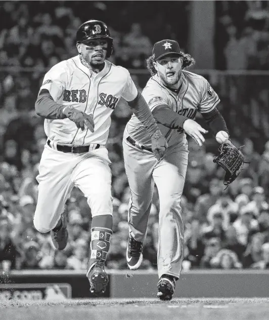  ?? Karen Warren / Staff photograph­er ?? Astros righthande­r Gerrit Cole, right, had a difficult time holding down Mookie Betts and the Red Sox, surrenderi­ng five runs in Sunday’s loss at Boston.