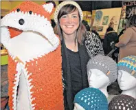  ?? DESIREE ANSTEY/ JOURNAL PIONEER ?? Danielle Gaudry, owner of Humina Humina in Augustine Cove, P.E.I., hooked many shoppers and casual browsers in the cafeteria location with her kaleidosco­pe of yarn inspiratio­ns.