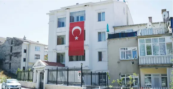  ?? (Reuters) ?? TURKEY’S NATIONAL flag hangs on the facade of a girls dormitory that was sealed by Turkish authoritie­s over alleged links to the followers of US-based cleric Fethullah Gulen, who Turkey accused of staging a coup attempt in July.