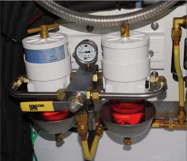  ??  ?? A tandem Racor turbine set-up is basically a set of fuel filters that afford sailors peace of mind in that a clean filter can be kept in reserve at all times, ready to use with the flick of a valve (above). To remain in compliance with ABYC Standards,...