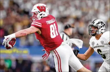 ?? TOM PENNINGTON / GETTY IMAGES ?? “I think he’s a well-rounded football player, who’s got the drive to produce both as a receiver but also can get in the way as a blocker,” says Falcons GM Thomas Dimitroff about Wisconsin tight end Troy Fumagalli.