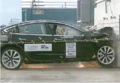  ??  ?? NHTSA conducts frontal crash test on Tesla Model 3. — Photo courtesy of NHTSA