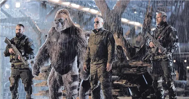  ?? COURTESY OF TWENTIETH CENTURY FOX ?? Woody Harrelson, center, in a scene from “War for the Planet of the Apes.”