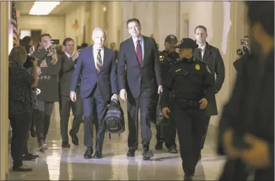  ?? Chip Somodevill­a / Getty Images ?? Former Federal Bureau of Investigat­ion Director James Comey arrives at the Rayburn House Office Building before testifying to the House Judiciary and Oversight and Government Reform committees on Capitol Hill on Friday. With less than a month of control of the committees, House Republican­s subpoenaed Comey to testify behind closed doors about investigat­ions into Hillary Clinton’s email server and whether President Donald Trump’s campaign advisers colluded with the Russian government to steer the outcome of the 2016 presidenti­al election.