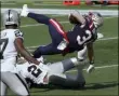  ?? STEVEN SENNE - THE ASSOCIATED PRESS ?? New England Patriots running back Rex Burkhead falls backward toward the end zone for a touchdown in the second half of an NFL football game against the Las Vegas Raiders, Sunday, Sept. 27, 2020, in Foxborough, Mass.