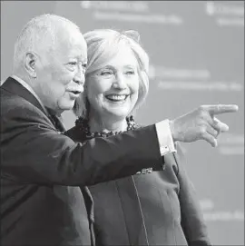  ?? Kevin Hagen
Getty Images ?? “WE HAVE TO come to terms with some hard truths about race and justice in America,” says Hillary Clinton, with former New York Mayor David Dinkins.