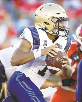  ?? JUSTIN REX/AP ?? Navy quarterbac­k Xavier Arline looks to pass during a game against Houston on Saturday night.