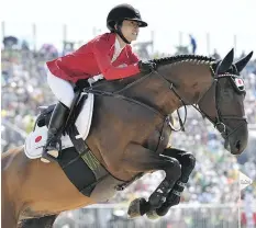  ?? — GETTY IMAGES ?? Japan’s Reiko Takeda says her Olympic partner Bardolino is constantly demanding attention — and food. ‘(He’s) always calling me, because he knows I spoil him. So I always have a lot of carrots.’