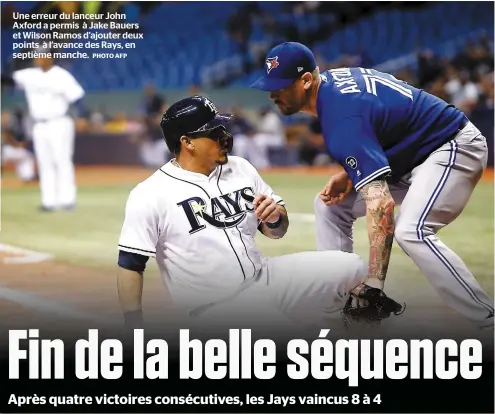  ?? PHOTO AFP ?? Une erreur du lanceur John Axford a permis à Jake Bauers et Wilson Ramos d’ajouter deux points à l’avance des Rays, en septième manche.