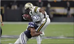  ?? BILL FEIG — THE ASSOCIATED PRESS ?? Dallas defensive end Robert Quinn, left, sacks Saints quarterbac­k Teddy Bridgewate­r during a Sept. 29 game in New Orleans.