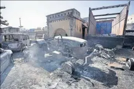  ?? HT FILE PHOTO ?? A police station in Jhajjar that was burnt by a mob. Police have floundered miserably while dealing with an unpreceden­ted violence that the state has ever witnessed.