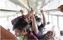  ?? ?? Passengers standing on an MTC bus on Sunday. Many have overlooked masks too