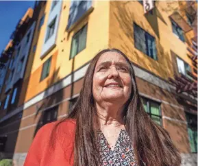  ?? JOEL ANGEL JUAREZ/ THE REPUBLIC ?? Diana Yazzie Devine, CEO of Native American Connection­s, poses for a portrait outside the Devine Legacy apartments in Phoenix on Jan. 17.