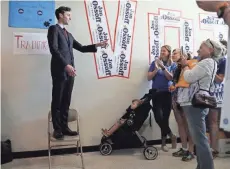  ?? GETTY IMAGES ?? Democratic candidate Jon Ossoff speaks to volunteers at a campaign office in Marietta, Ga., as he runs for Georgia’s 6th Congressio­nal District in a special election to replace Tom Price. The primary election is Tuesday.