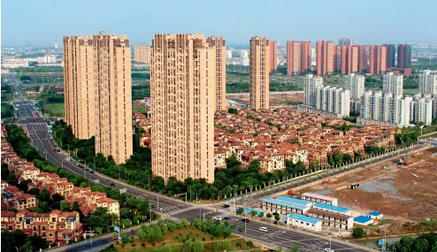  ??  ?? Los rascacielo­s de Changzhou, en la provincia de Jiangsu, una vista común en las grandes ciudades chinas.