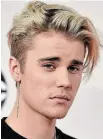  ?? JORDAN STRAUSS THE ASSOCIATED PRESS ?? Justin Bieber’s disclosure he has been battling Lyme disease brings attention to the disease. Avril Lavigne, centre, and Shania Twain have also dealt with Lyme disease.