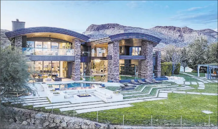  ?? The Ivan Sher Group ?? A Summerlin mansion in The Ridges’ exclusive Promontory Pointe neighborho­od set the luxury sales record in 2020 at $14.5 million.