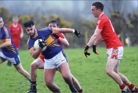  ??  ?? Jeff O’Donoghue, Glenflesk breaks away from the challenge of Oran Clifford, Waterville in the Kerry County Castleisla­nd Mart Intermedia­te Championsh­ip in Barraduff Community Field on Saturday Photo by Michelle Cooper Galvin