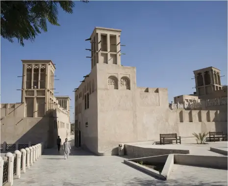  ?? Getty Images ?? Wind towers are a common sight in the Old Dubai neighbourh­ood of Al Fahidi, and hark back to historic architectu­re