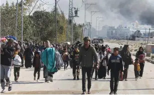  ?? (Ibraheem Abu Mustafa/Reuters) ?? PALESTINIA­NS FLEE Khan Yunis and move toward Rafah, in the southern Gaza Strip, in January. Hamas delights in collateral damage even to its own people. Yet the intensity of its conviction­s is what attracts followers, say the writers.