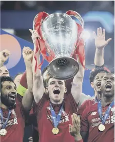  ??  ?? 0 Andrew Robertson gets his hands on the Champions League.