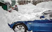  ?? Salgu Wissmath/The Chronicle ?? Carlos Gonzalez shovels snow off his car in front of his home in South Lake Tahoe on Wednesday.