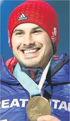  ?? Pictures: PA. ?? The rink skipped by Perth’s Kyle Smith, left, remains joint third in the bid for Olympic curling glory in Pyeongchan­g; skeleton slider Dom Parsons, above, is all smiles after he landed a surprise bronze medal.