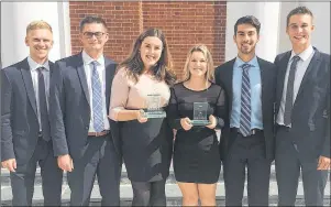  ?? SUBMITTED PHOTO ?? UPEI business students from left, Callum Wood, Alex Dunne, Sydney Gallant, Shanna Blacquiere, Zach Geldert and Jacob Ezeard, won first place in a case competitio­n at Acadia University recently.