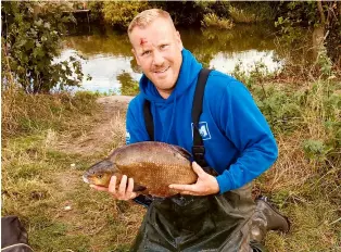  ?? ?? Rich Lacey with one of the bream that made up his winning 66lb 7oz haul