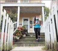 ?? Christian Abraham / Hearst Connecticu­t Media ?? Community Health Care worker Beverly Reyes, with Family Centers of Stamford, goes door-to-door along Willams Street in Stamford on Aug. 31 to encourage people to get the vaccine if they haven't already.