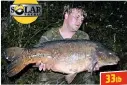  ??  ?? USING a baiting pole to position his Solar Squid pop-up under an overhangin­g bush at Burghfield Blue
Pool, Berks, resulted in this fine 33lb mirror for Matthew Nuttall.