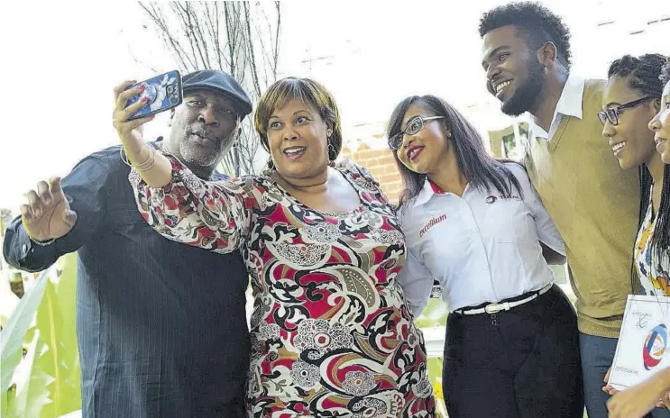  ??  ?? Chris Okonmah, (left) managing director, Total Jamaica, strikes his best selfie pose as Lisa Vasciannie, lecturer, internatio­nal relations and coordinato­r, French-caribbean Programme, University of the West Indies, turns photograph­er while (from left) Melissa Anderson, human resources manager, Total Jamaica; Tafar-i Williams, Total Jamaica 2017 scholarshi­p recipients Samantha Powell winner; Total Jamaica 2018 sc and Gabrielle Buddoo give their best to the lens.