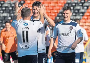  ??  ?? Bobby Linn takes the plaudits after his penalty won the tie for Arbroath