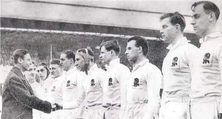  ??  ?? Honour: The King meets England in 1938, Giggleswic­k star Mike Marshall second from right