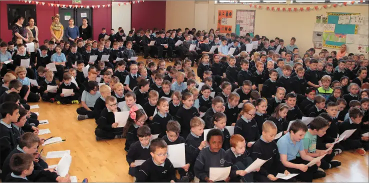  ??  ?? Pupils assemble at an event promoting Féile in St. Joseph’s primary school in Gorey.