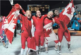  ?? MATHEW MCCARTHY, RECORD STAFF ?? Heather Moyse, left, Helen Upperton, Kaillie Humphreys and Shelley-Anne Brown celebrate their gold and silver medals following the women's bobsled competitio­n at the Whistler Sliding Centre at the 2010 Vancouver Olympic Winter Games in Whistler, B.C.