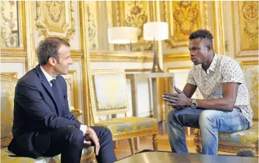  ?? Picture: THIBAULT CAMUS/VIA REUTERS ?? JUST REWARD: French President Emmanuel Macron meets Mamoudou Gassama at the Elysee Palaces in Paris