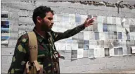  ??  ?? A Houthi fighter gestures as he secures the site of a protest by staffers of the Yemen’s state oil company outside the United Nations’ offices to demand easing restrictio­ns on oil shipments to Houthi-held ports, in Sanaa, yesterday.