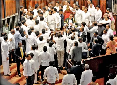  ??  ?? Rowdy scenes in Parliament on Thursday.