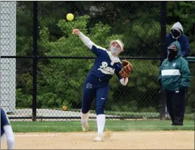  ?? OWEN MCCUE - MEDIANEW GROUP ?? Above, Spring-Ford’s Danielle McNeil throws across the diamond Wednesday against Methacton. Below, Methacton pitcher Paige Deal delivers toward the plate Wednesday.