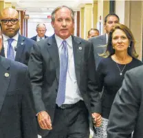  ?? Melissa Phillip / Staff file photo ?? Texas Attorney General Ken Paxton and his wife, Angela Paxton, arrive for a hearing in the Harris County Criminal District Court in Houston in 2017. A reader reacts now that Paxton is suing San Antonio, claiming it broke the law.