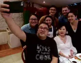  ??  ?? A few years before her passing, Imelda Cojuangco (in white), with her grandson JJ Yulo taking the selfie, and, back row, from left, Kat Ong, Hannah Pira, Him Uy de Baron, Jeremy Slagle and Jen Slagle