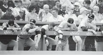  ?? MICHAEL DWYER/ASSOCIATED PRESS ?? The Orioles watch from the dugout during the fourth inning. With Sunday’s 5-0 loss to the Red Sox, the Orioles became the first major league team in nearly a decade to be shut out while recording 13 or more hits.