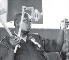  ??  ?? Officer Commanding Operations Gwanda District, Superinten­dent Stephen Mutema shows some of the recovered weapons that were used in gold wars