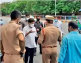  ?? — DC ?? Congress leader A. Revanth Reddy speaks to a Begumpet police officer who stopped him near the Hyderabad Public School on Sunday.