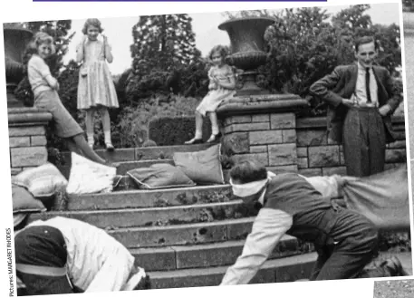  ?? ?? Full of fun: From left, Margaret Rhodes (then Elphinston­e) and Princesses Elizabeth and Margaret watching as the grown-ups play ‘Are you there, Moriarty?’. Right: The royal sisters and their friend in a tug o’war