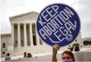  ?? Kevin Dietsch / Getty Images ?? An abortion rights activist demonstrat­es outside the U.S. Supreme Court on Oct. 4 in Washington.